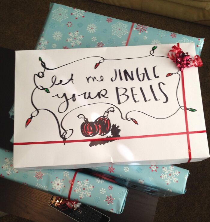 Funny Christmas gift wrap with playful holiday lights and a cheeky handwritten message, perfect for inspiring some mischief.