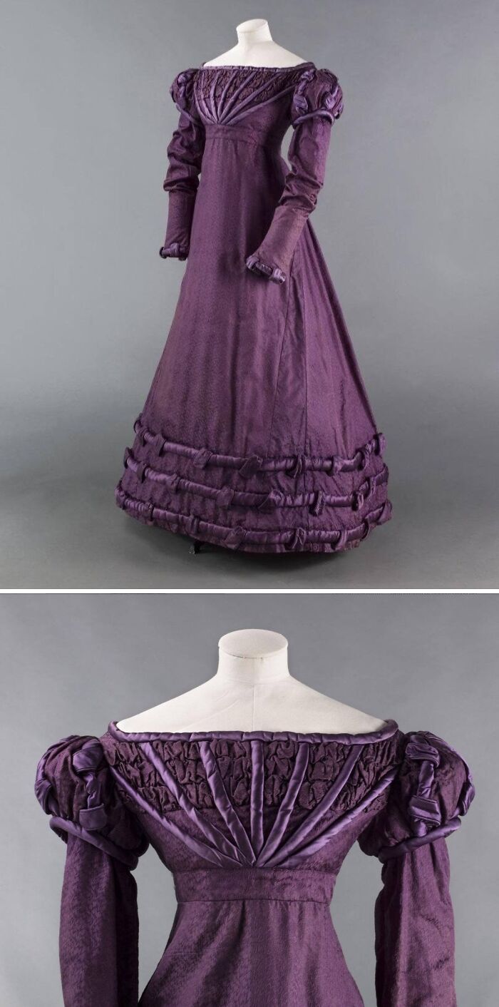 Purple vintage dress displayed on a mannequin, showcasing intricate design and fabric details in historical old photos.