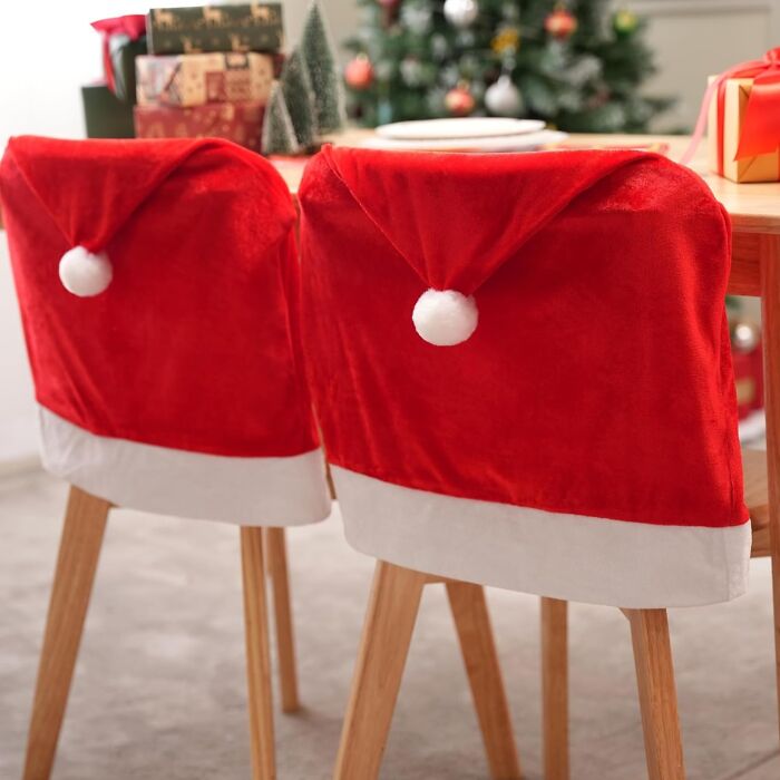 These Santa Hat Chair Covers Are Transforming Your Dining Room Into A Jolly Wonderland, One Chair At A Time