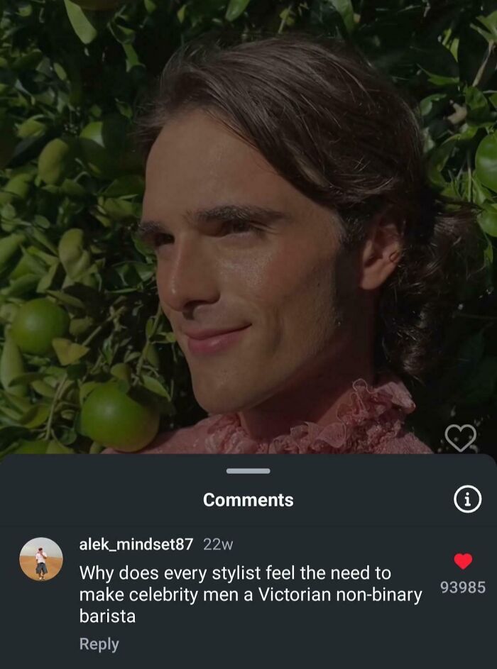 Young man with styled hair and a smirk, pictured outdoors with green apples, reflecting epic burns in 2025.