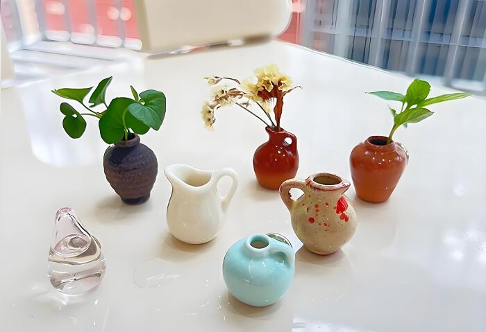 Assorted small vases with greenery and flowers, perfect last-minute gifts for unexpected holiday guests.