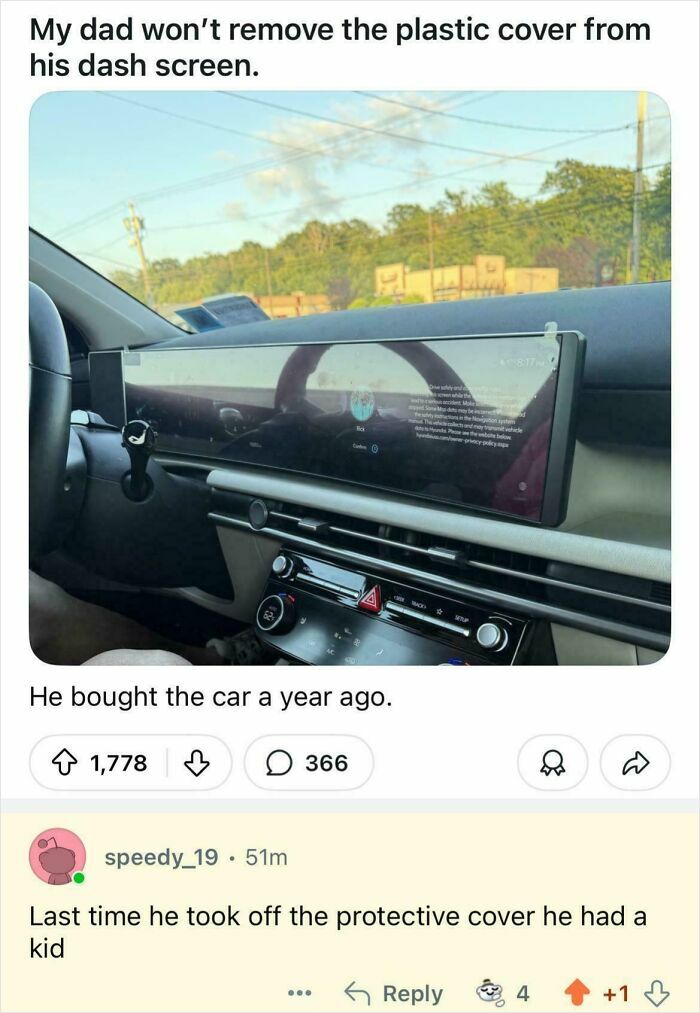Car dashboard screen covered in plastic, a funny epic burn turning a dad's habit into art and humor in 2025.