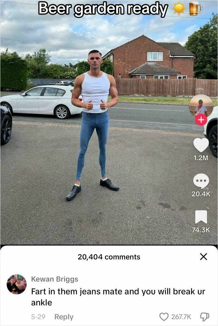 Man wearing extremely tight jeans standing outdoors with thousands of comments, showcasing epic burns in 2025.