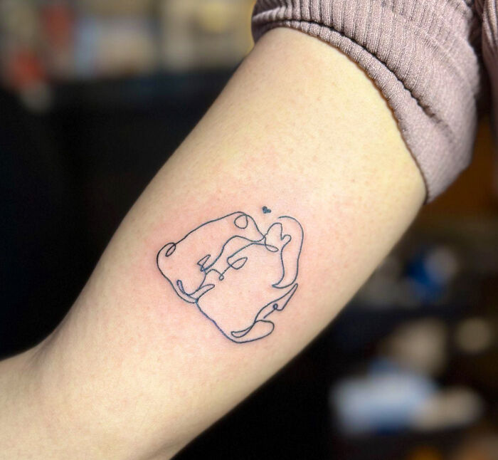Minimalist pet tattoo on forearm, a beautiful tribute turning memories of people's pets into lasting art.
