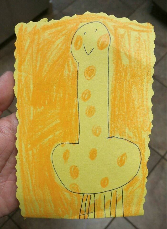 Child's funny drawing of a flattering portrait with orange spots on yellow paper showing unique kid creativity.