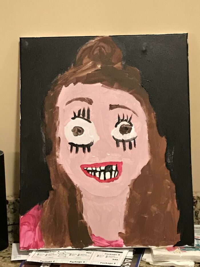 Child's funny drawing of a very flattering portrait with exaggerated facial features and playful expression.