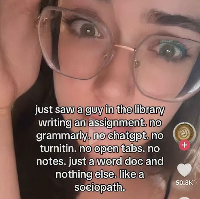 Close-up of a student wearing glasses sharing a college meme about writing assignments with no digital tools or notes.
