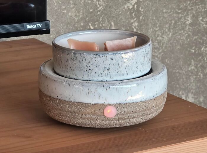 Ceramic scented candle gift on wooden table, an ideal host gift that says thank you for feeding me uniquely