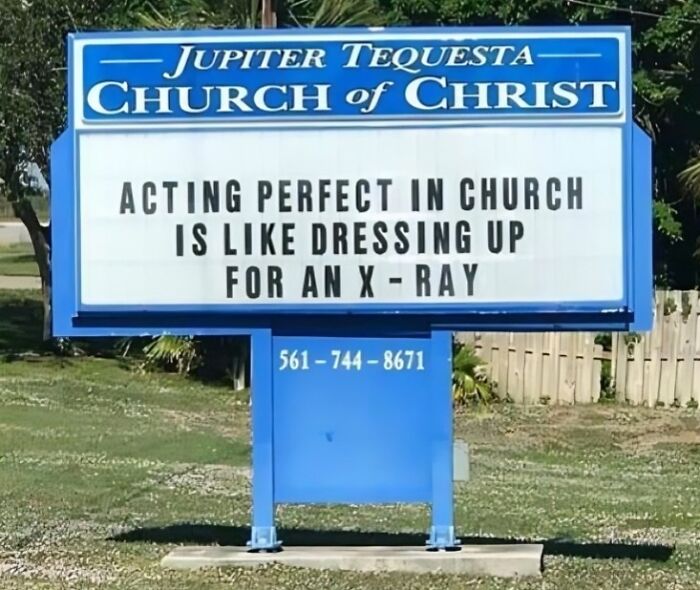 Church sign with a funny joke about acting perfect in church, blending humor with faith and community spirit outdoors.