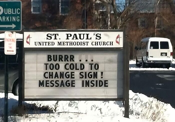 Church sign joke reading "BURRR... too cold to change sign! Message inside" on a snowy day at St. Paul's United Methodist Church.