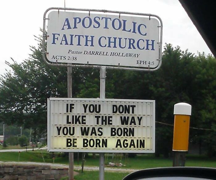Church sign with funny joke about being born again displayed outside Apostolic Faith Church in a suburban area.