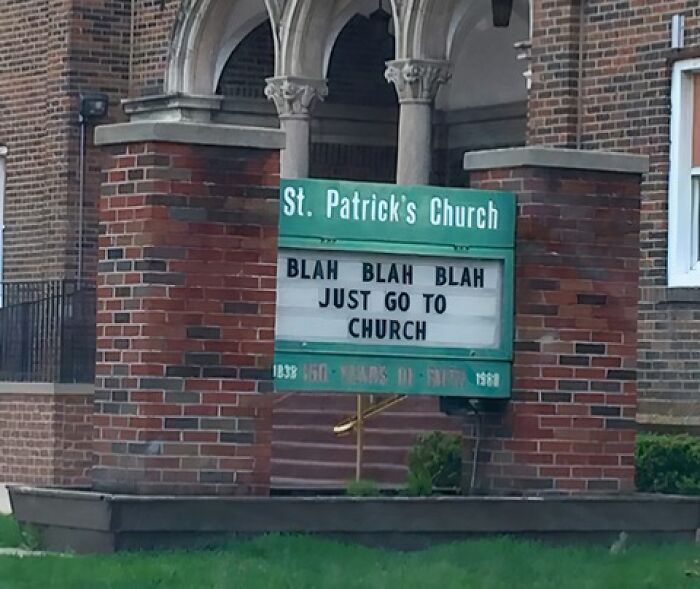Church sign outside St. Patrick’s Church with a humorous message encouraging people to just go to church.
