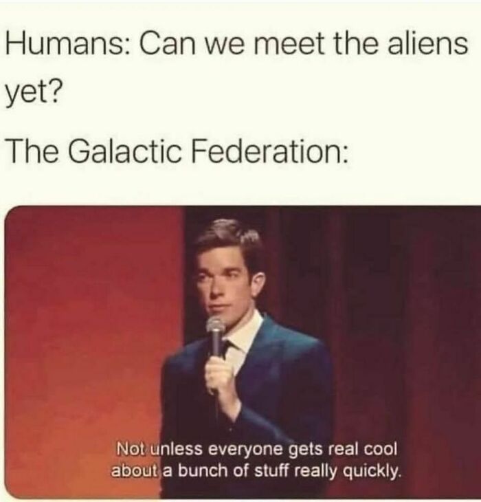 Comedian on stage delivering a funny meme about humans meeting aliens, relating to disassociate in a fun way.
