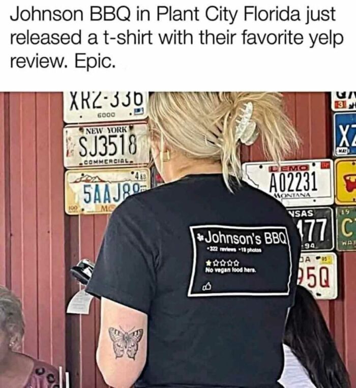 Person wearing a funny Johnson BBQ t-shirt with a sarcastic Yelp review, showcasing humorous memes to help disassociate.