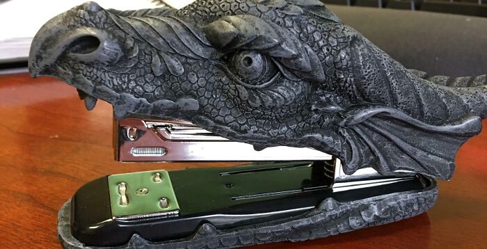 Dragon-shaped stapler with detailed scales and eye design, one of the most bizarre things people received as Christmas gifts.