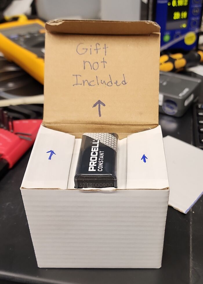 Small battery in large box with handwritten note gift not included, an example of bizarre Christmas gifts received by people.