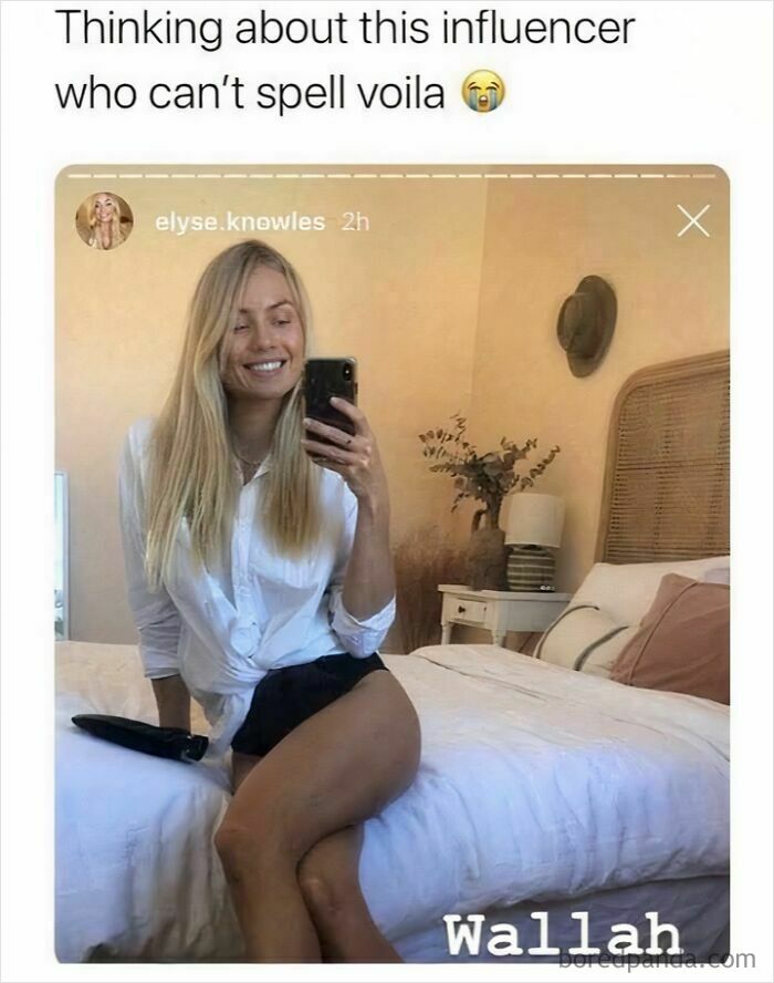 Influencer sitting on bed smiling, taking mirror selfie, with text about funny spelling fail and watching stupidity fail.