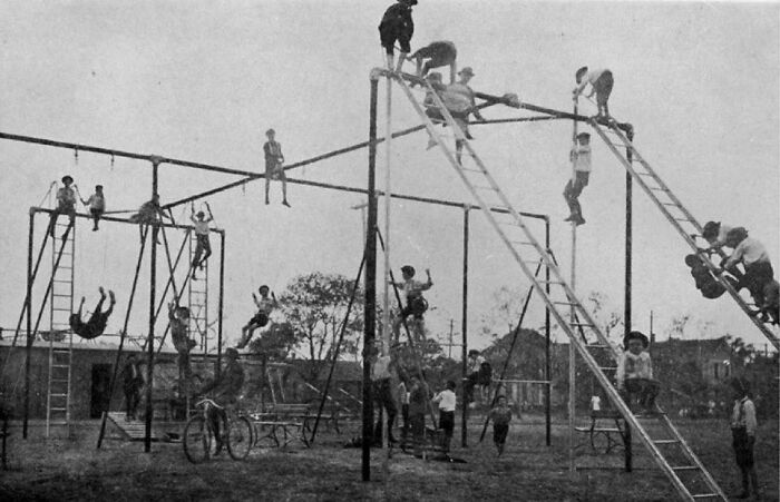 Children playing on a unique playground structure, showing an interesting and rare recreational setup outdoors.