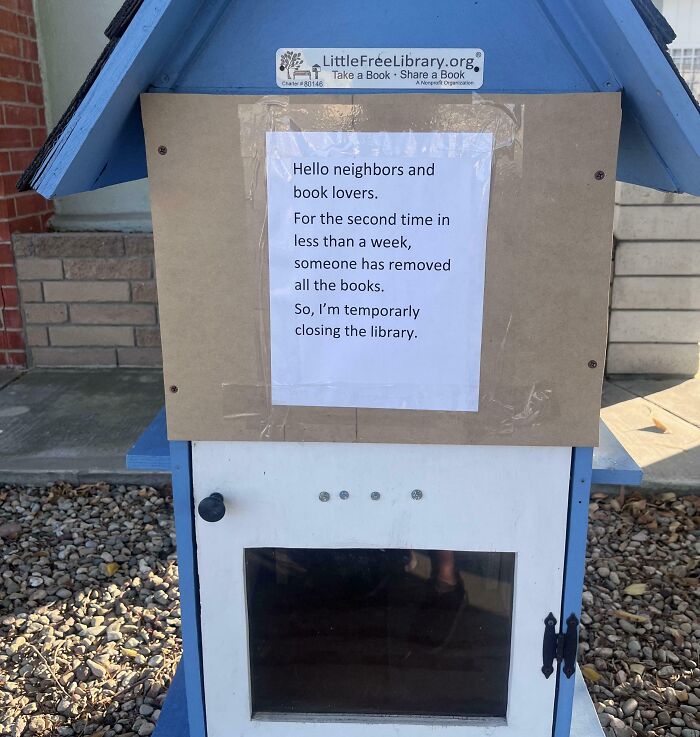 Little Free Library with taped notice closing after books were stolen, an example of next-level jerks.