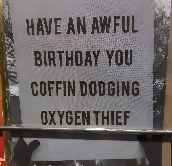 Funny stupid signs pic showing a birthday message calling someone a coffin dodging oxygen thief.