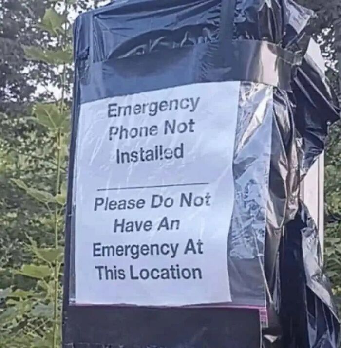 Funny stupid signs pic showing a notice warning not to have an emergency where no emergency phone is installed outdoors
