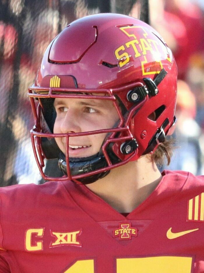 Brock Purdy in Iowa State football helmet and jersey looking to the side during a game.