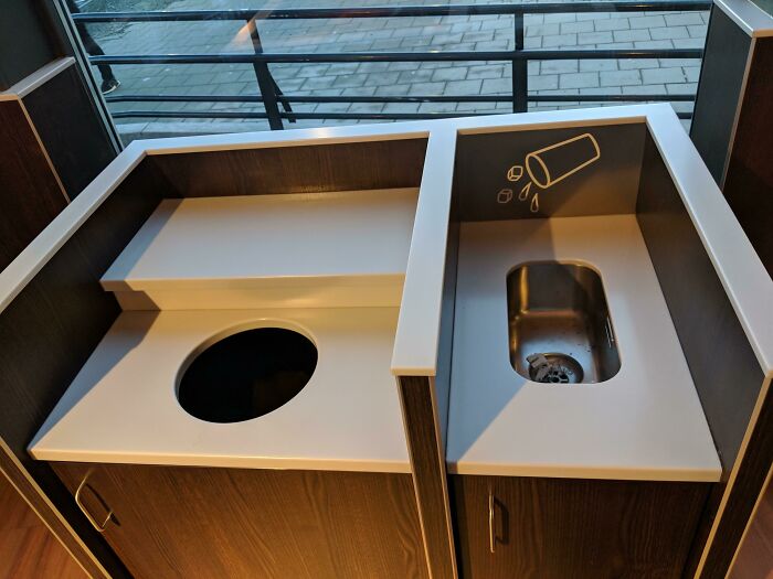 Recycling station with separate compartments for trash and liquid waste, an impressive thing countries implemented for better waste management.