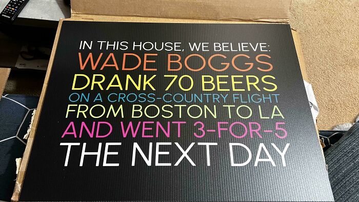 Colorful sign with a humorous message about drinking beers on a flight, highlighting fun moments with siblings.