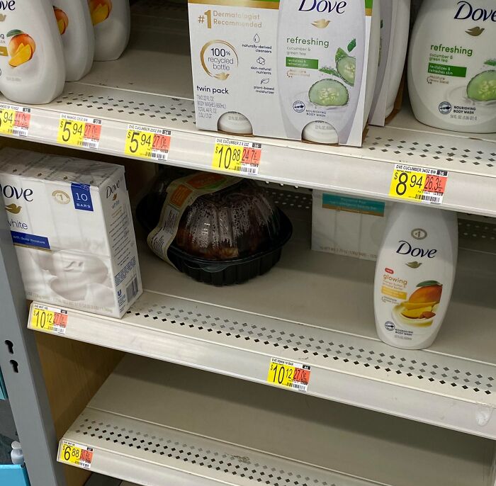 Empty Dove shelf with a rotisserie chicken left among body washes, an example of next-level jerks