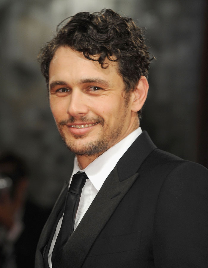 James Franco wearing a black suit and tie, smiling and attending a formal event, related to Hollywood career insights. James Franco wearing a black suit and tie, smiling and attending a formal event, related to Hollywood career insights.