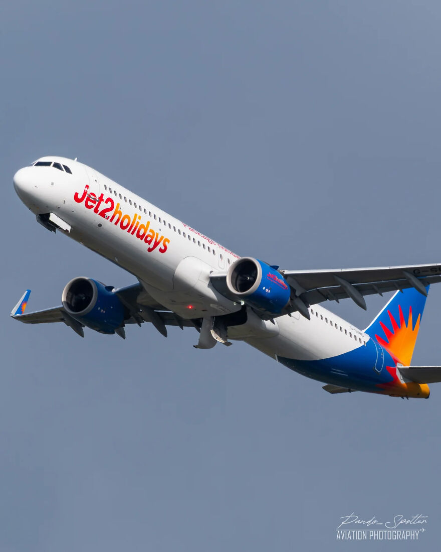 Jet2holidays airplane in flight against a clear sky, illustrating unforgettable 2025 pop culture moments in travel.