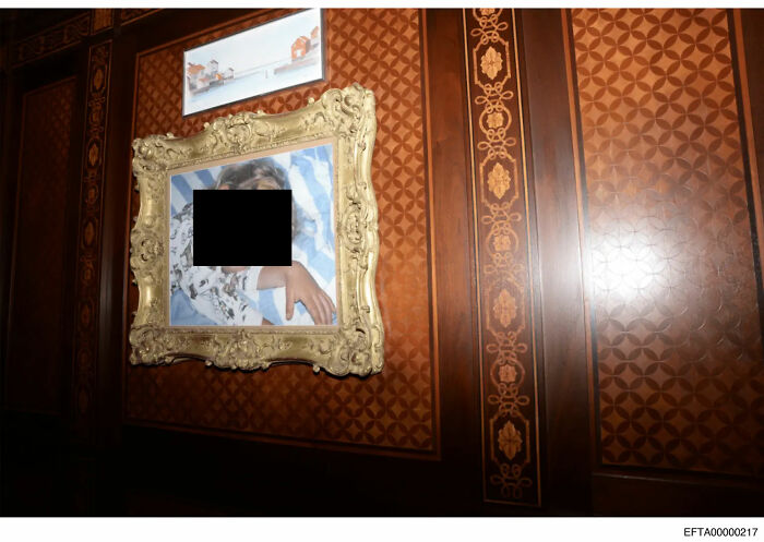 Ornate framed artwork on wooden paneled wall in NYC townhouse linked to Epstein file dump revealing troubling art.