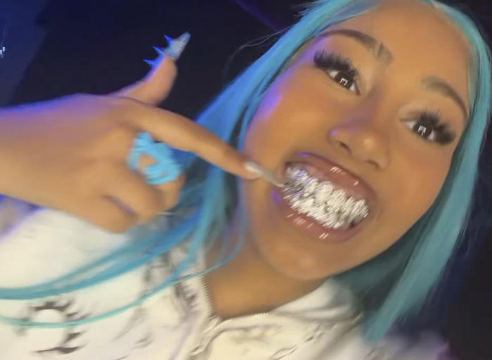 North West, 12, with blue hair and diamond grill, sparks divided reactions with her controversial new look.