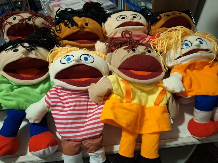 Colorful puppets arranged together representing joyful gifts that unleash a level of 5-year-old happiness and excitement.