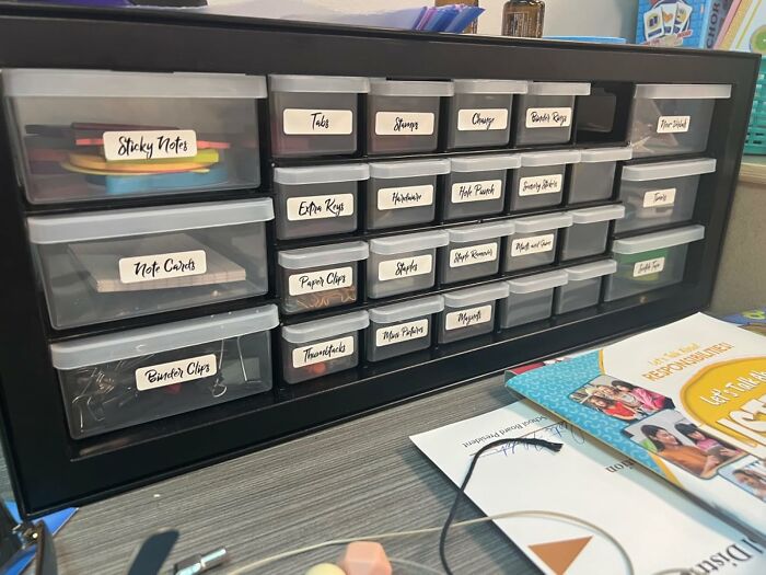 Organized teacher desk drawer with labeled compartments for office supplies, an ideal gift for patient, caffeine-loving educators.