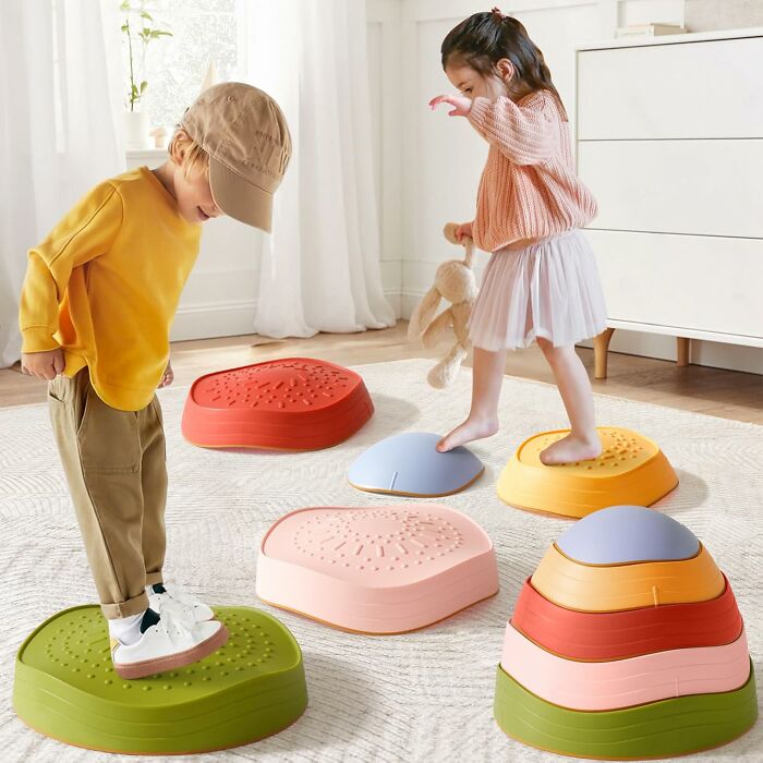 Two children playing on colorful balance stepping stones, showcasing gifts that spark 5-year-old joy and active fun.