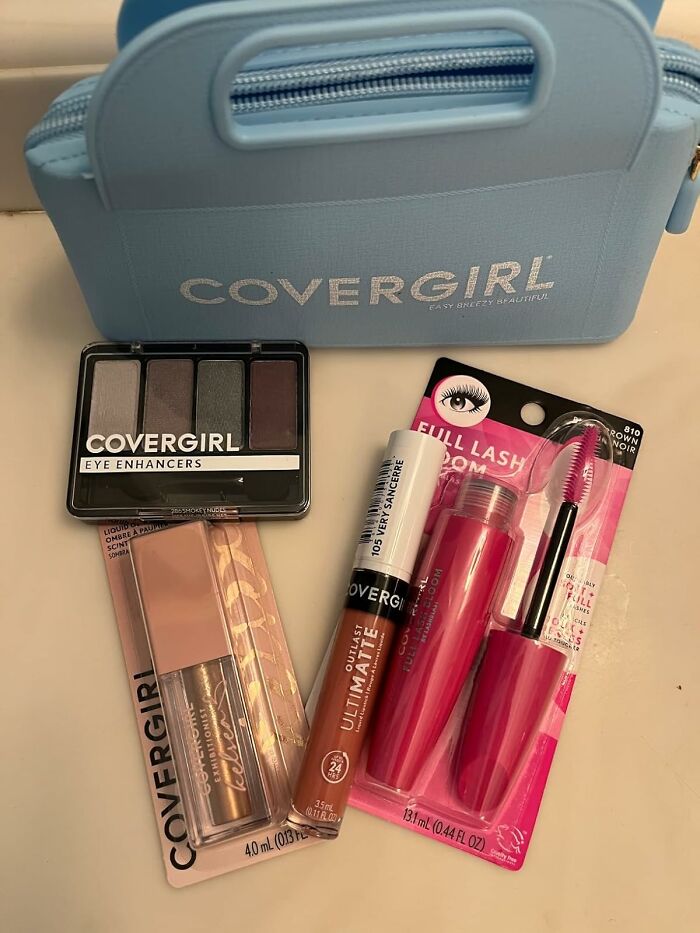 Covergirl makeup products including eye enhancers, lipstick, and mascara, perfect for a Christmas morning blind box surprise.