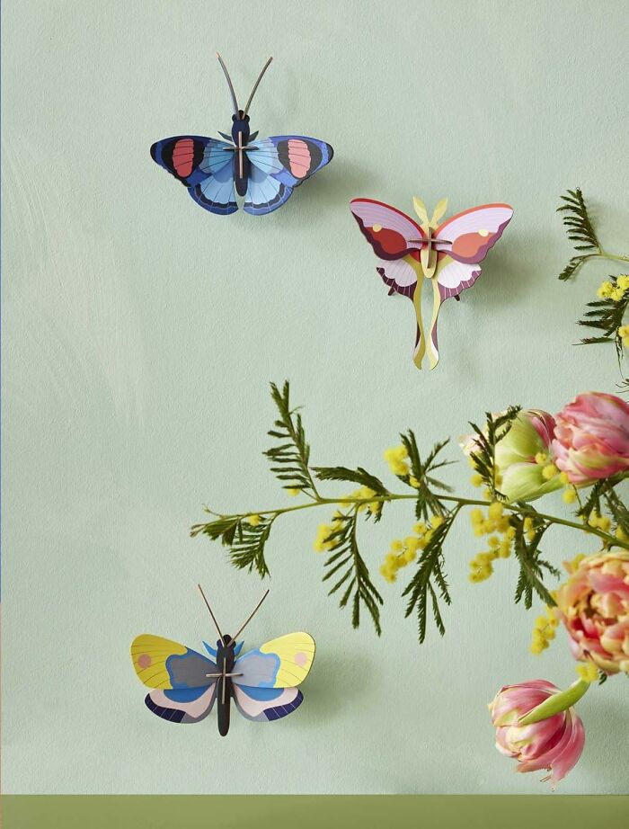 Decorative colorful butterfly wall art with floral accents, perfect gifts for the friend from a Hobby Lobby isle.