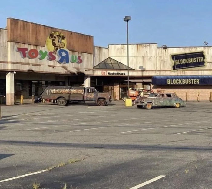 Abandoned Toys R Us and Blockbuster stores with rusted vehicles, evoking nostalgia and creaking joints memories.