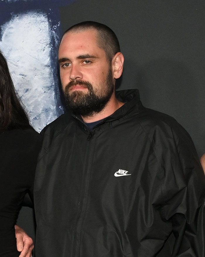 Man with beard wearing a black Nike jacket, related to Rob Reiner and son Nick fight before fatal incident news. Man with beard wearing a black Nike jacket, related to Rob Reiner and son Nick fight before fatal incident news.