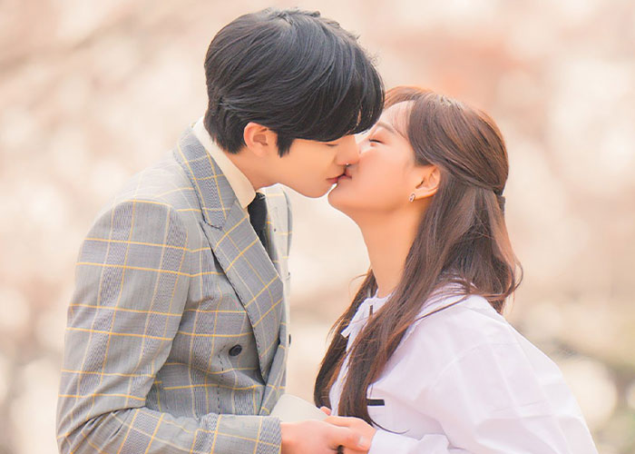 Young Korean couple sharing a romantic kiss, portraying K-Drama-style date moments and intimate encounters scene. Young Korean couple sharing a romantic kiss, portraying K-Drama-style date moments and intimate encounters scene.