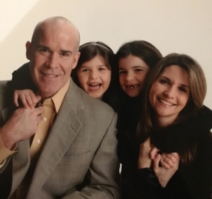 Family portrait showing parents and two daughters smiling together in a warm setting, related to sorority girl tragic accident.