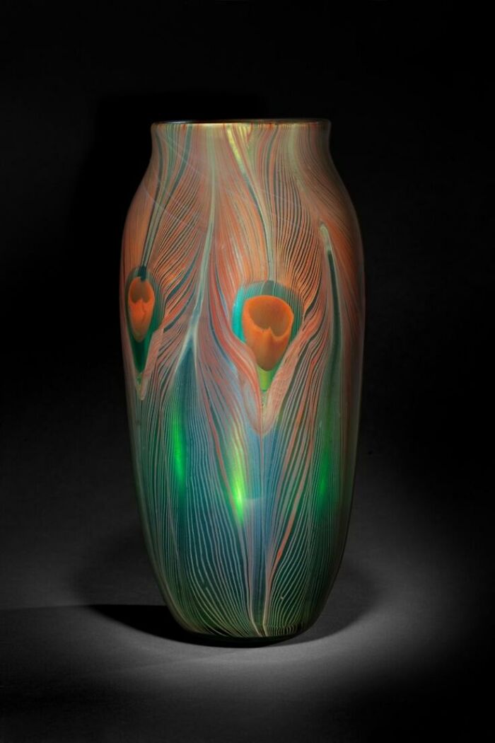 Colorful old glass vase with intricate patterns, capturing culture and everyday life from the past in a powerful photo.