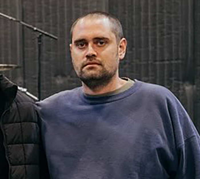 Man with short hair and beard wearing a blue sweatshirt, depicting Nick Reiner from explosive fight with dad incident.