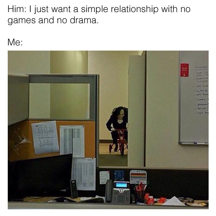 Office cubicle with dark goth figure on a red tricycle lurking in hallway, a humorous goth meme about relationships and drama.