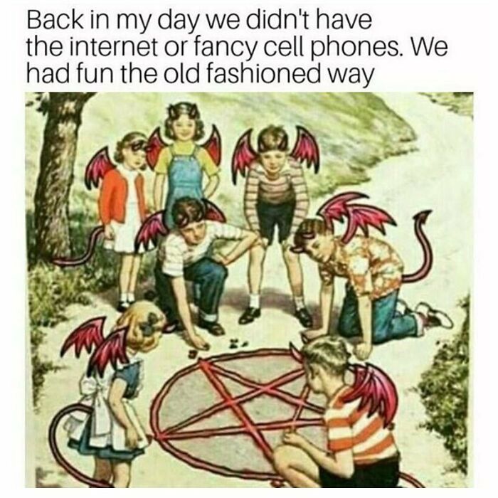 Children with red devil wings playing around a pentagram on the ground, a goth meme about old-fashioned fun without the internet.