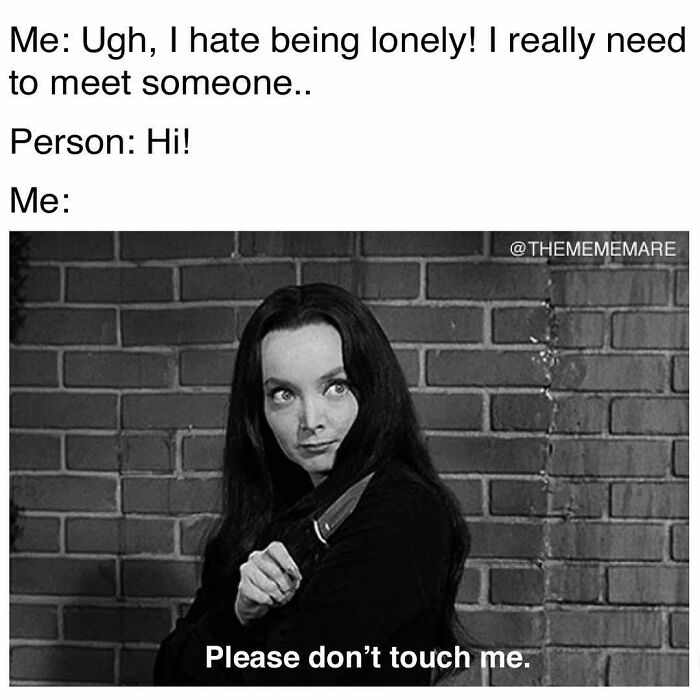 Black and white goth meme with a woman holding a knife, captioned about loneliness and wanting to be left alone.
