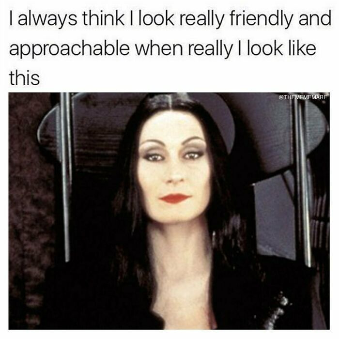Goth meme with a serious woman’s face and text about looking friendly but appearing gothic and unapproachable.