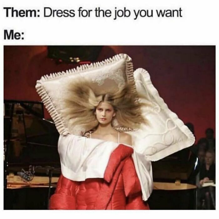 Person dressed in a red outfit with two large pillows and hair spread out, illustrating goth memes about not fitting in.