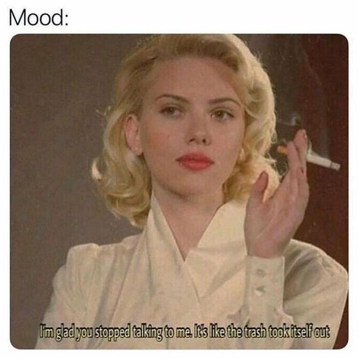 Woman with blond hair in vintage style holding a cigarette, expressing a mood of satisfaction in a goth meme context.